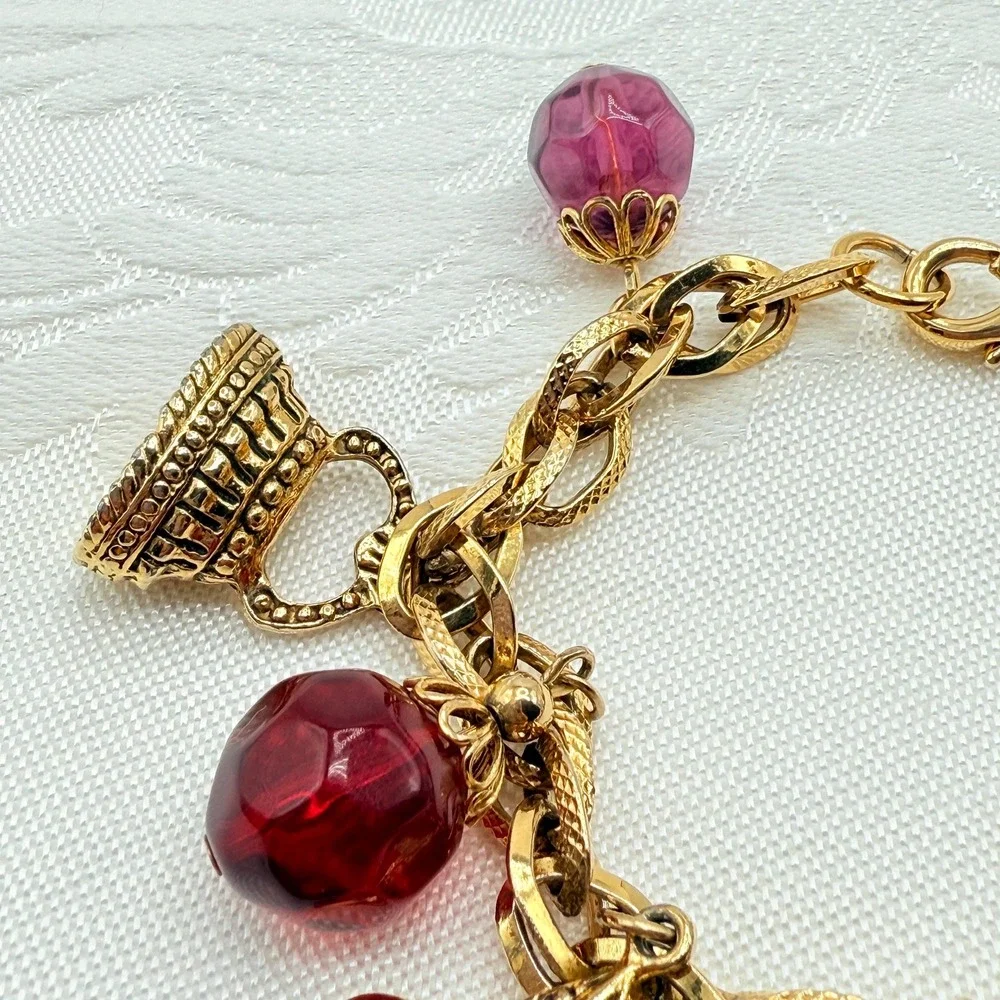 Vintage Gold Tone Charm Bracelet w/ Fleur de Lis, Ring, and Faceted Glass Beads